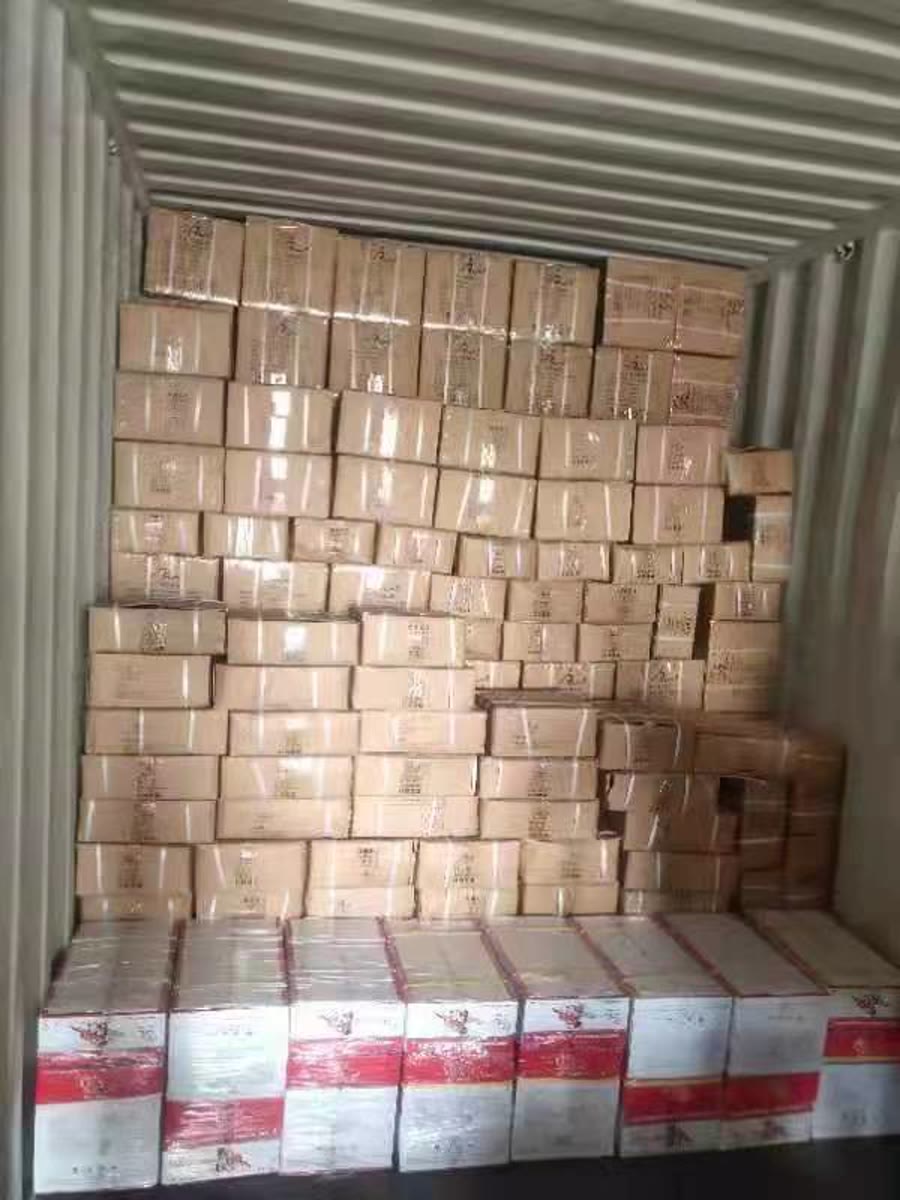 Cartons arranged inside a shipping container during an export shipment